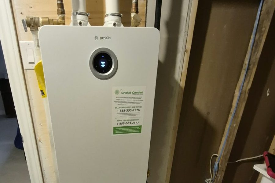 Bosch tankless water heater on a basement wall