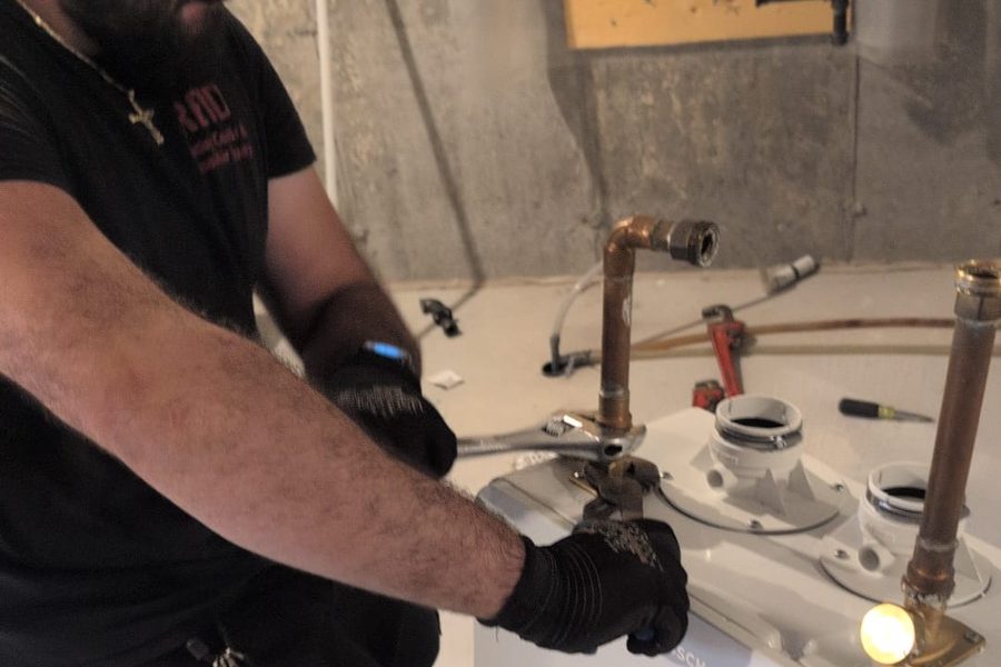 Mr. Rental Tank technician servicing a water heater
