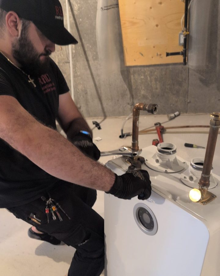 Mr. Rental Tank technician connecting a Bosch tankless water heater