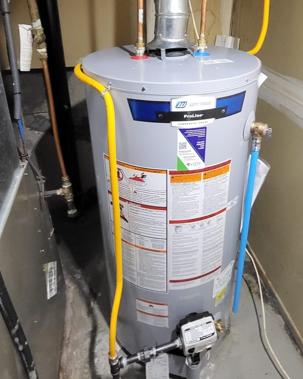 John Wood conventional chimney-vent water heater with draft hood and flue
