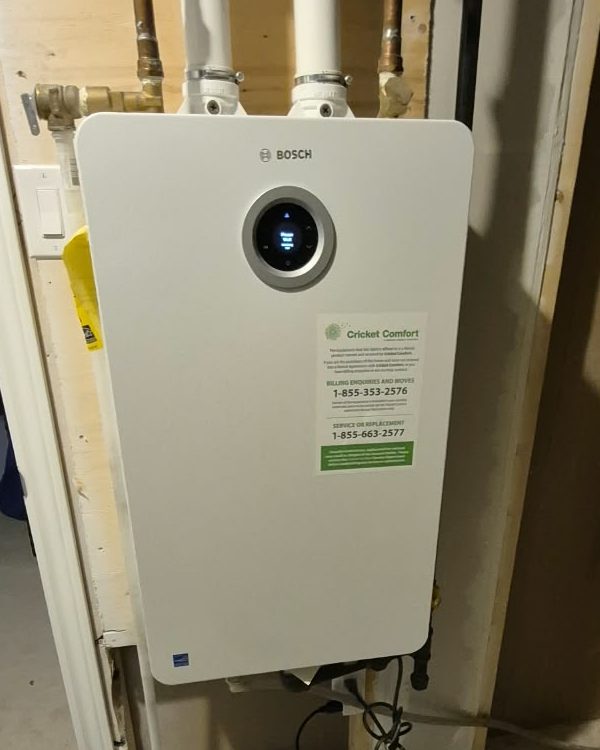 Bosch tankless water heater on a basement wall